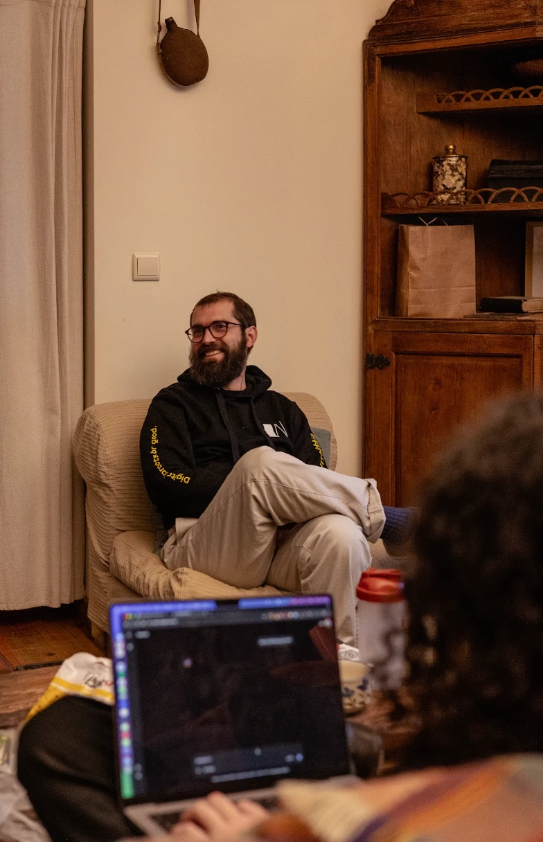 Whitesmith team member smiling in an armchair at a retreat