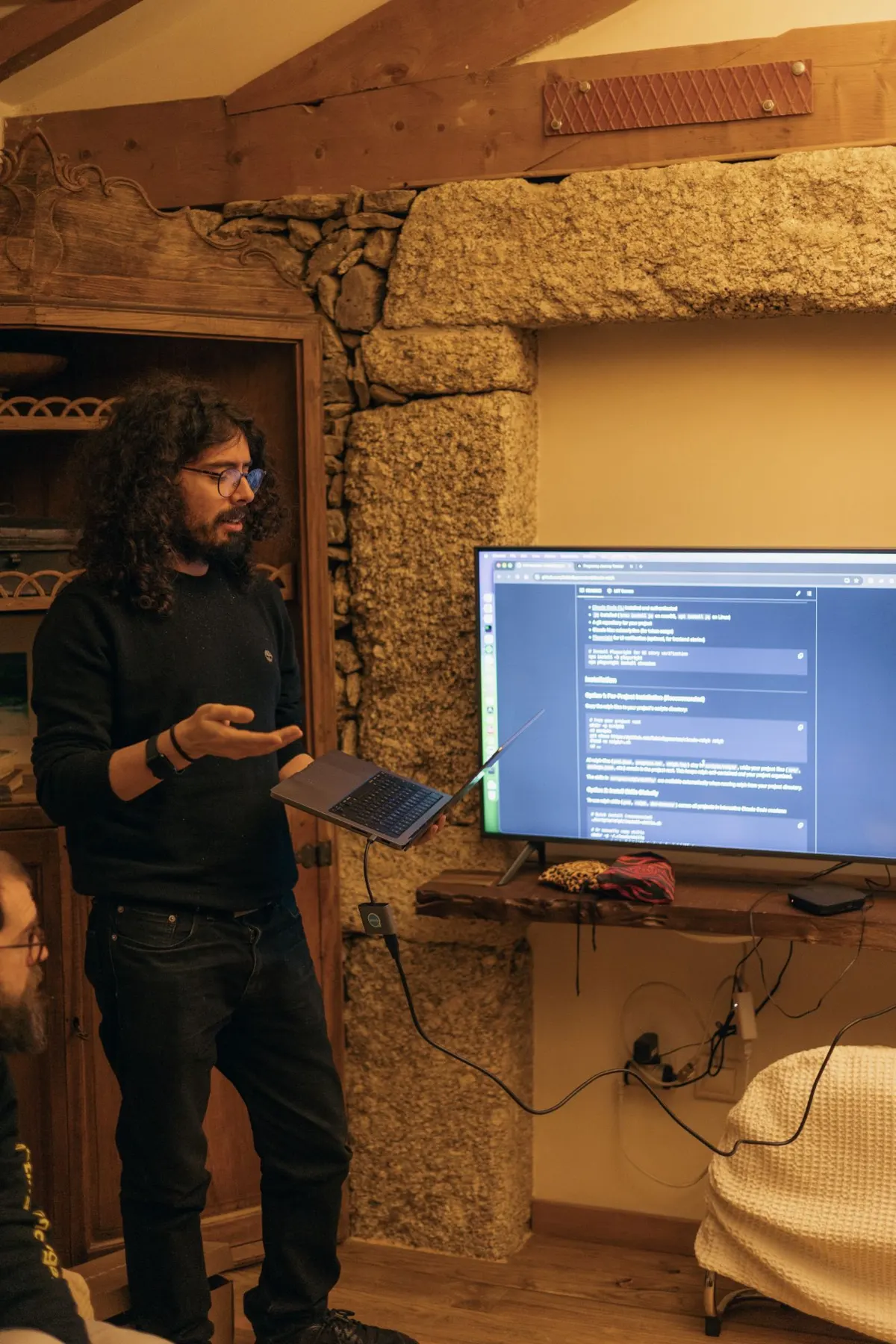Whitesmith team member presenting a demo on a screen at a retreat
