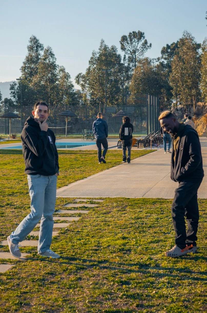 Two Whitesmith team members laughing on the lawn at a retreat