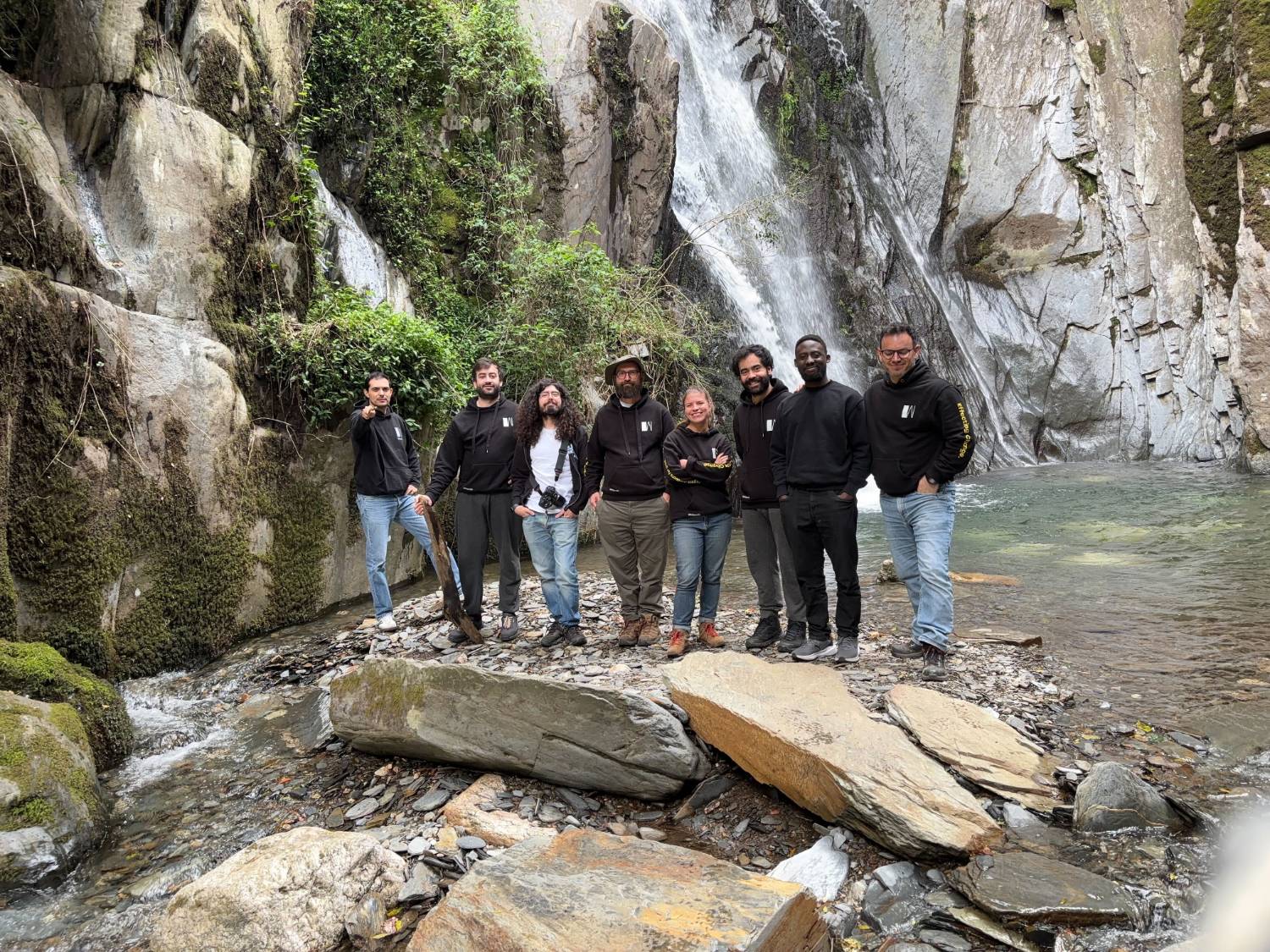 Whitesmith team at a waterfall
